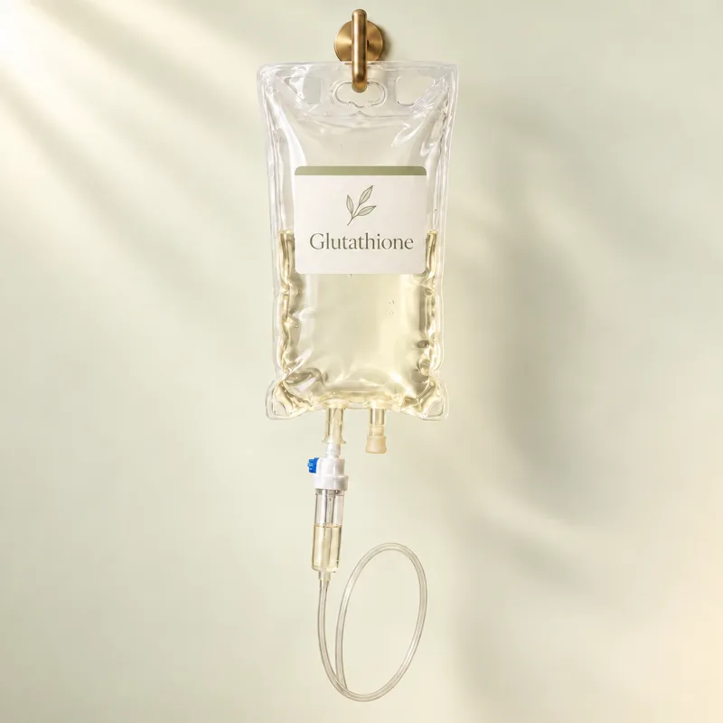 A Glutathione Detox IV bag hanging from a brass hook